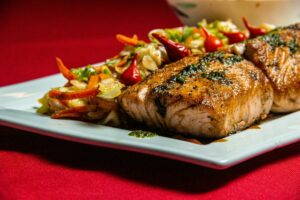 grilled salmon on white ceramic plate